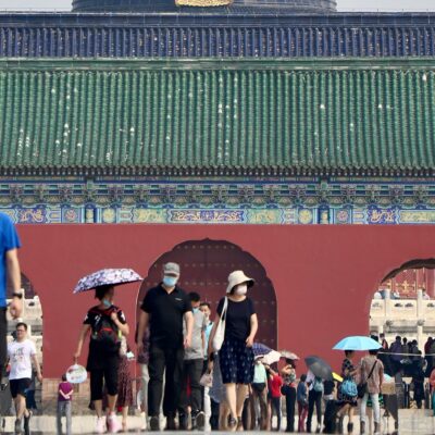 People standing near the Temple of Heaven in Beijing.