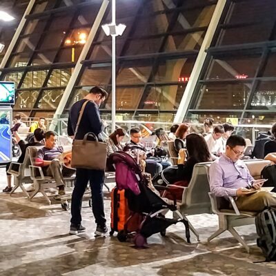 People waiting for a flight at Shanghai Pudong International Airport.