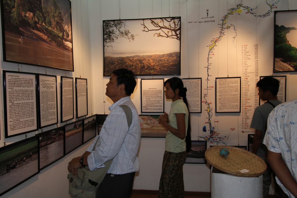 People viewing the ‘Art of the Watershed' exhibition (2011). Image used with permission from the Goldman Environmental Prize.