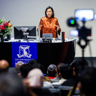Sri Mulyani Indrawati standing at a podium delivering the 2026 Southeast Asia Oration at the University of Melbourne.